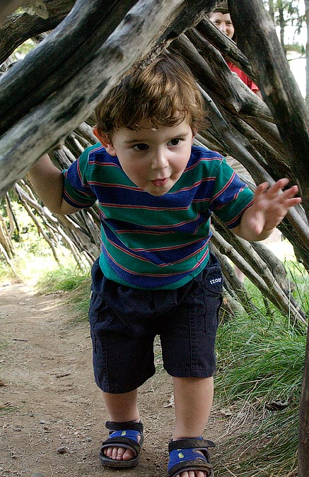Noah inside a sculpture; Decordova Museum, Lincoln, MA; ; Nikon D1X; 7/14/2002 1:20:53.3 PM; Color; Data Format: RAW (12-bit); Compression: None; Image Size: Large (3008 x 1960); Lens: 28-105mm f/3.5-4.5; Focal Length: 28mm; Exposure Mode: Aperture Priority; Metering Mode: Multi-Pattern; 1/90 sec - f/8; Exposure Comp.: +1/3 EV; Exposure Difference: 0 EV; Flash Sync Mode: Not Attached; Sensitivity: ISO 800; Color Mode: Mode II (Adobe RGB); Hue Adjustment: 3; White Balance: Direct sunlight; Tone Comp: Normal; Sharpening: Normal