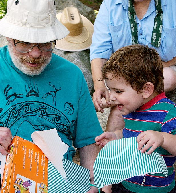 Grandpa Steve and Noah getting a birthday present; Decordova Museum, Lincoln, MA; ; Nikon D1X; 7/14/2002 1:44:22.1 PM; Color; Data Format: RAW (12-bit); Compression: None; Image Size: Large (3008 x 1960); Lens: 28-105mm f/3.5-4.5; Focal Length: 38mm; Exposure Mode: Aperture Priority; Metering Mode: Multi-Pattern; 1/320 sec - f/8; Exposure Comp.: +1/3 EV; Exposure Difference: 0 EV; Flash Sync Mode: Not Attached; Sensitivity: ISO 800; Color Mode: Mode II (Adobe RGB); Hue Adjustment: 3; White Balance: Direct sunlight; Tone Comp: Normal; Sharpening: Normal