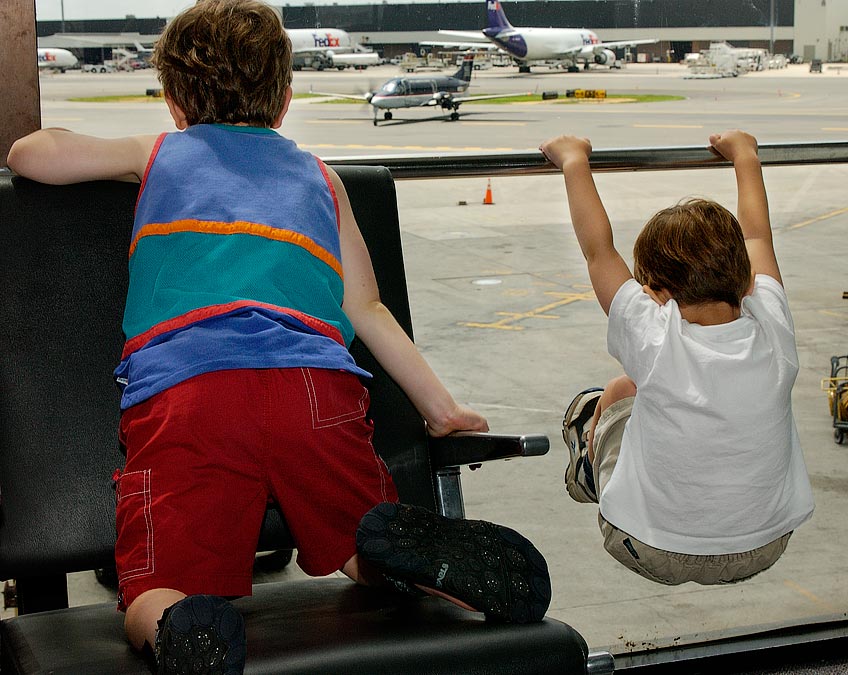 Eytan and Noah watching planes at Logan on the way to Charlotte, NC; Boston, MA