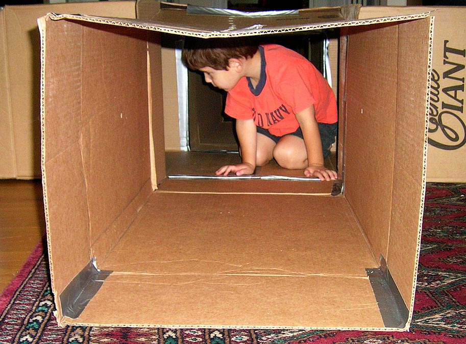 Noah crawling through the tunnels he and Anne built for his birthday party; Eytan\'s camera/picture
