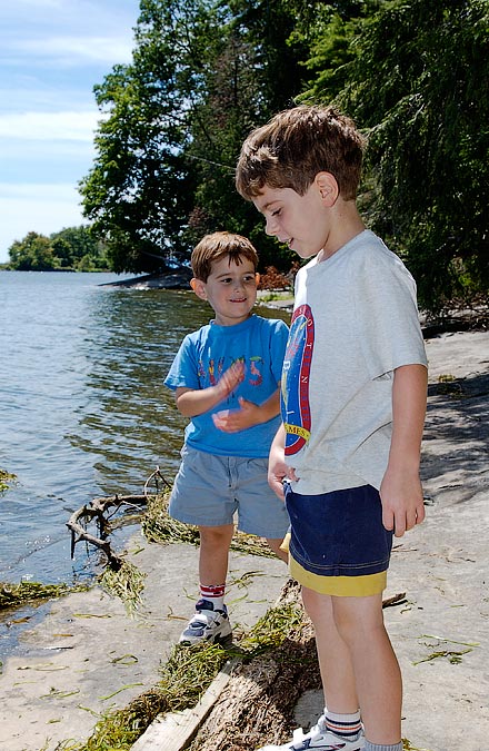 Noah and Eytan looking for things to throw; Button Bay, Lake Champlain, VT