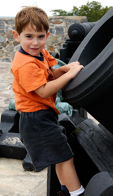 Noah climbing on a cannon at Fort Ticonderoga, NY