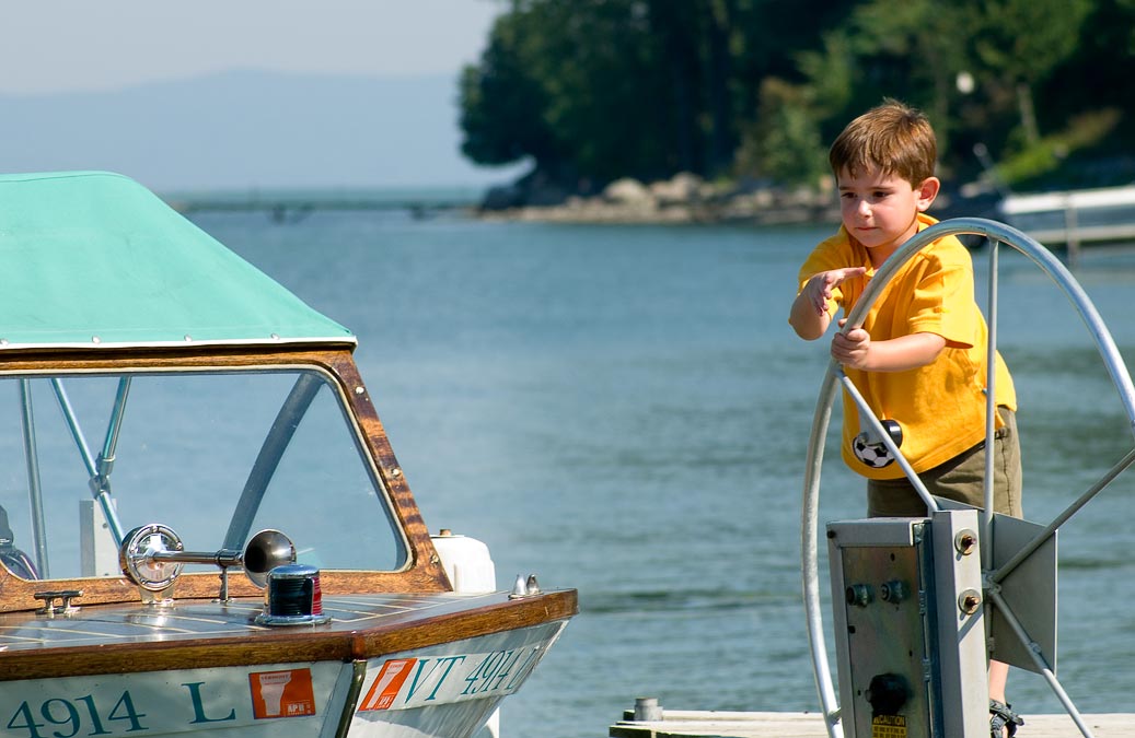 Noah raising Pete and Daphne\'s motor boat; Addison; VT; US