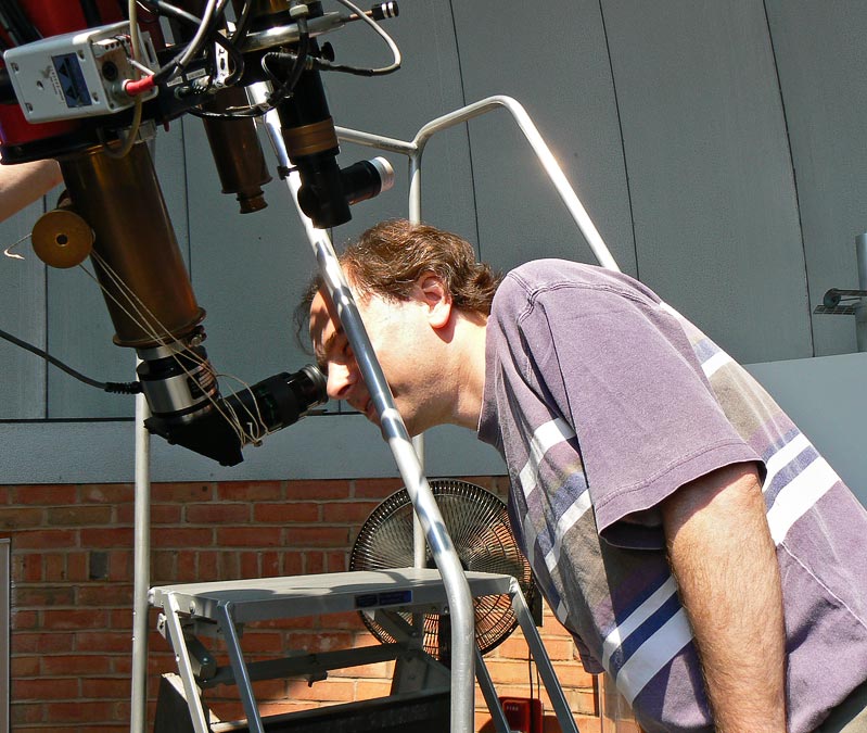 Maryland Science Center; Michael looking through telescope at the sun; Baltimore; MD; US