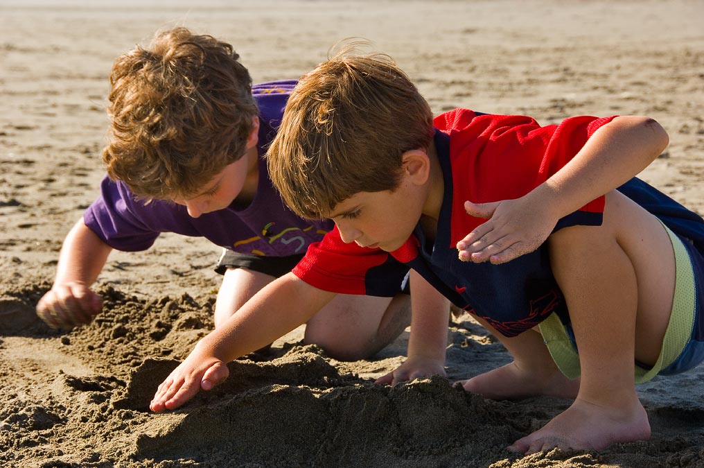 L-R: Eytan and Noah digging in the sand; Seaside; OR; US