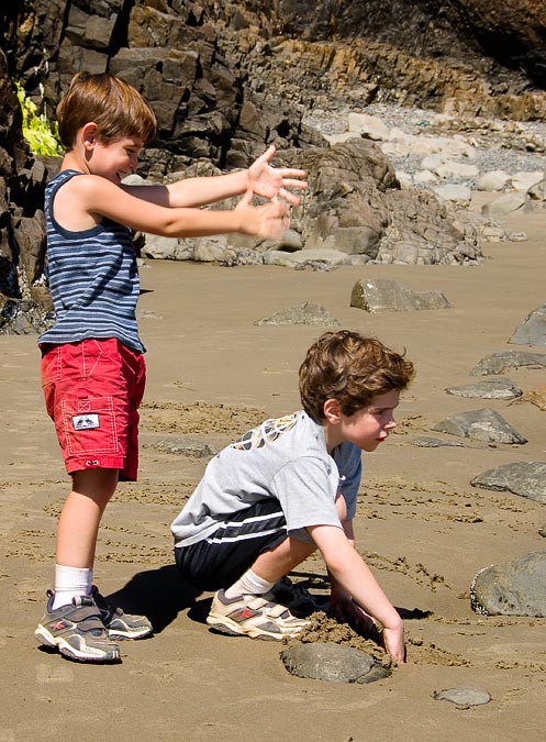 Noah wiping sand off over Eytan; Ecola State Park; Cannon Beach; OR; US