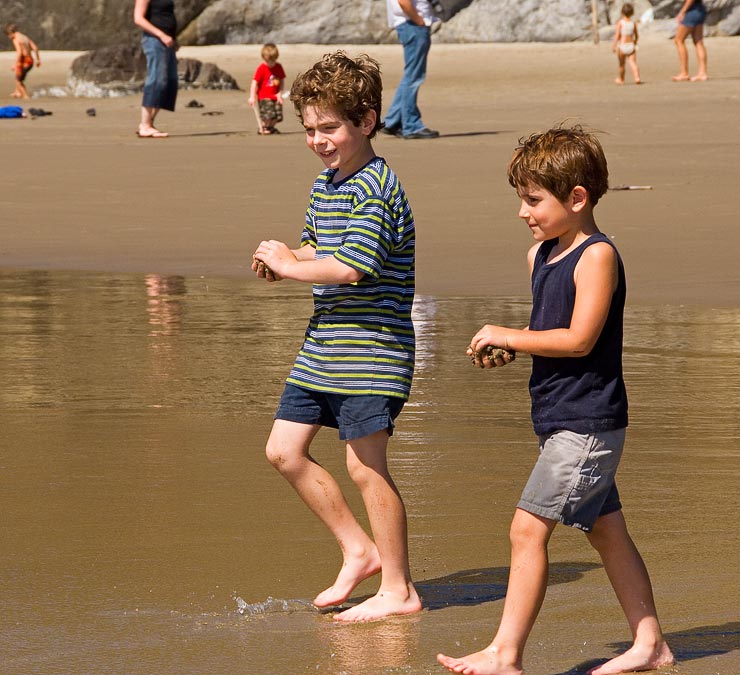 L-R: Eytan and Noah bringing sand to throw into waves; Beach south of Cannon Beach; OR; US