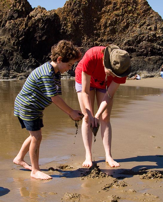 Eytan and Anne making drip sand castles; Beach south of Cannon Beach; OR; US