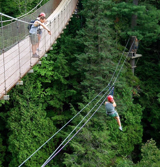 Zip-line across the canyon next to a suspension bridge; Canyon Sainte-Anne; Quebec; Quebec; CA
