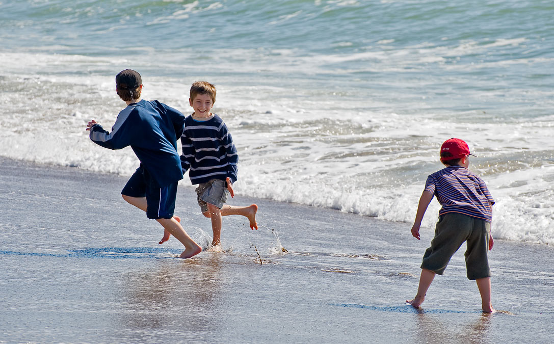 Running from waves: Eytan, Luke and Noah; Point Reyes; CA; US